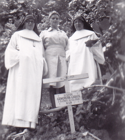 Lieutenant (junior grade) Mary E. Adams, USN, with Sister Angelica and an unidentified nun, at the gravesite of Sister Genoveva, who was killed during the Battle of Saipan, circa 1946. Sister Angelica, who was on Saipan in 1937, told Adams about an American white man and woman who “became known as Amelia Earhart and Noonan” who were “tortured to death” by the Japanese on Saipan in the prewar years (Courtesy Mary Patterson.)