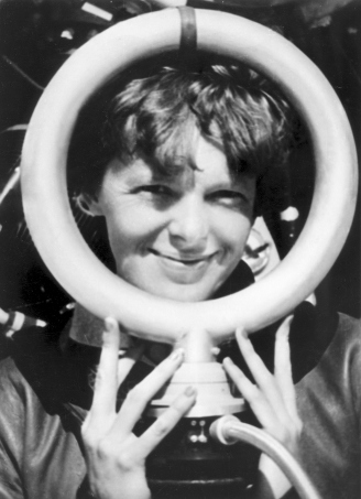 Amelia with the Bendix Radio Direction Finder Loop Antenna, which replaced Fred Hooven's Radio Compass for use during her world flight attempt in 1937. Hooven was convinced that the change was responsible for Amelia's failure to find Howland Island, and ultimately, for her tragic death on Saipan. 