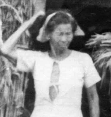 This is the unidentified Okinawan woman who encountered Sgt. Thomas E. Devine on Saipan in August 1945, urgently informing him of the gravesite of a "white man and woman who had come from the sky." 