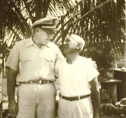 Cmdr. Paul W. Bridwell, chief of the U.S. Naval Administration Unit on Saipan, and Jose Pangelinan, who told Fred Goerner he saw the fliers but not together, that the man had been held at the military police stockade and the woman kept at the hotel in Garapan. Pangelinan said the pair had been buried together in an unmarked grave outside the cemetery south of Garapan. The Japanese had said the two were fliers and spies. (Photo by Fred Goerner, courtesy Lance Goerner.)